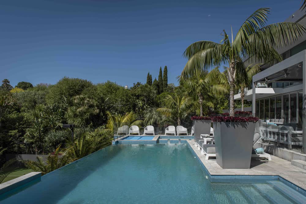 Maintained tiny garden and pool area with tropical planting